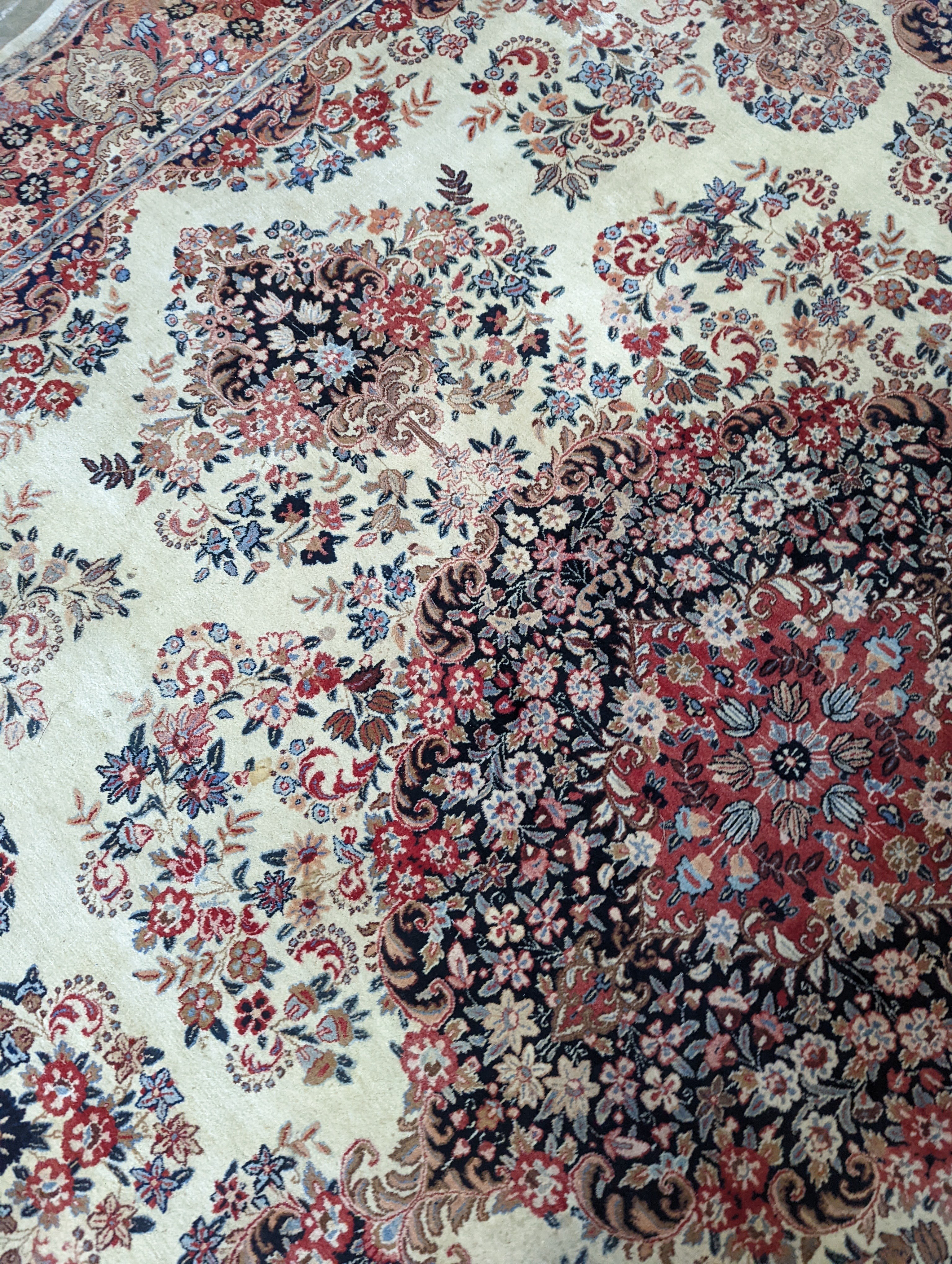 A North West Persian ivory ground carpet, 410 x 310cm